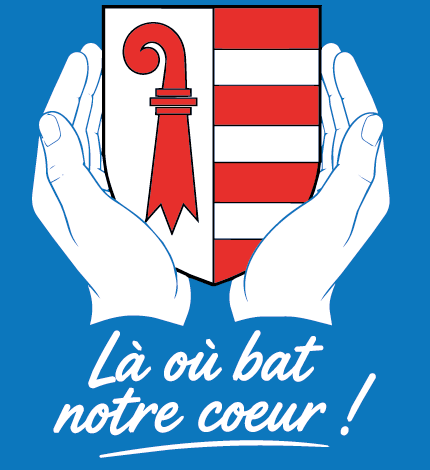 Écusson jurassien entre deux mains et slogan Là où bat notre coeur